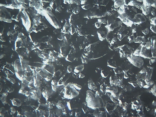 Microscope Picture of Crushed Glass Abrasive Magnification