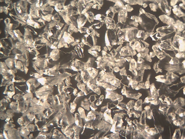 Microscope Picture of Aluminum Oxide (White) Abrasive Magnification
